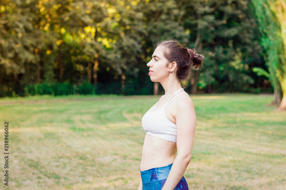 Slim young woman looking into the distance.Sport concept Slim young woman looking into the distance.Sport concept
