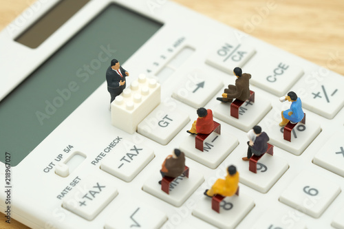 Wallpaper Mural Miniature people Pay queue Annual income (TAX) for the year on calculator. using as background business concept and finance concept with copy space  for your text or  design. Torontodigital.ca