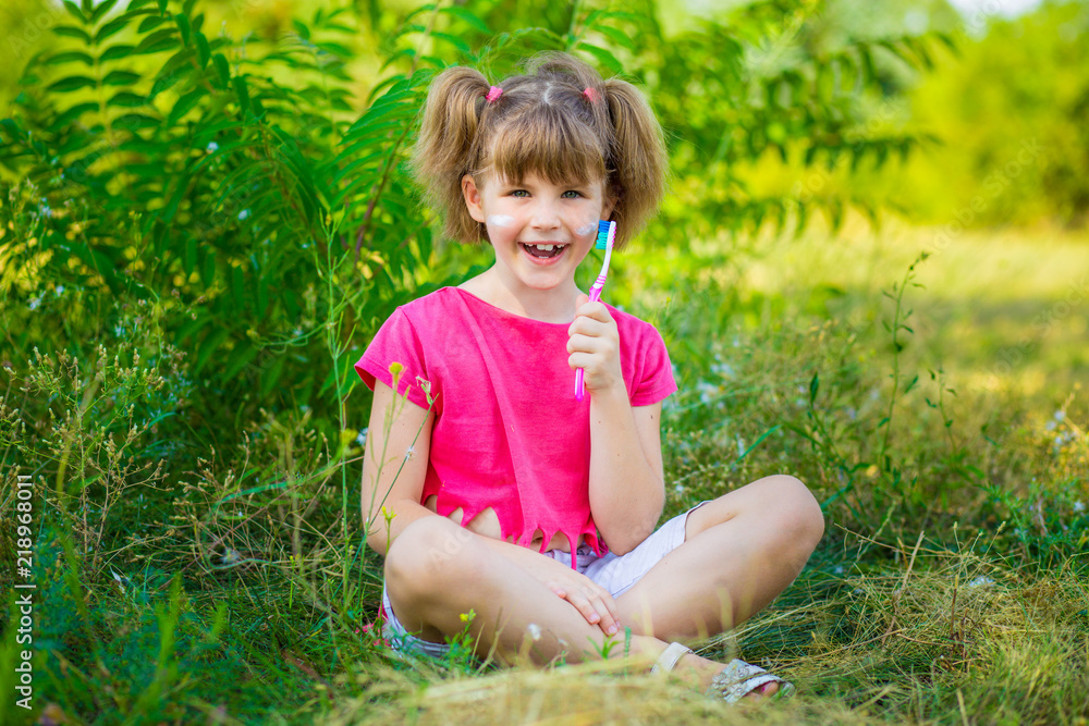 Happy little girl brushing her teeth. Dental hygiene. Healthy concept Happy little girl brushing her teeth. Dental hygiene. Healthy concept