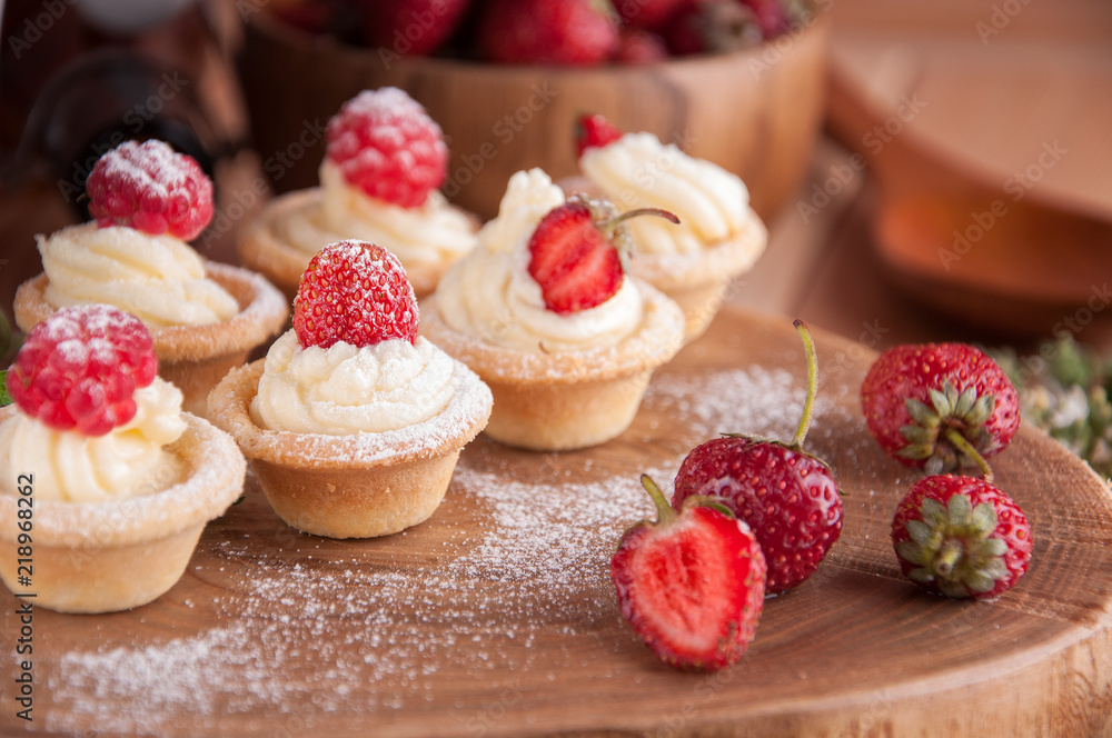 Tartlets with cream, raspberries, strawberries. Tartlets with cream, raspberries, strawberries.