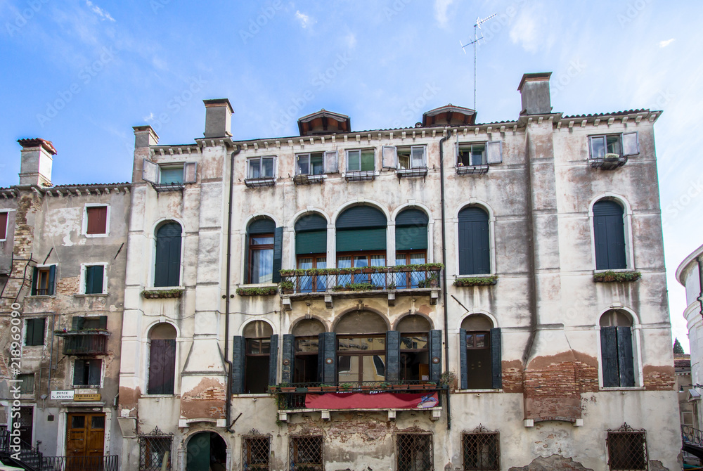 Old palace on the small canal of Venice, Italy