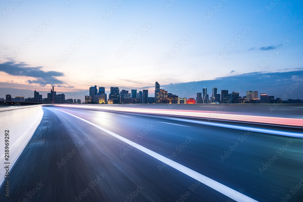 busy traffic road with city skyline