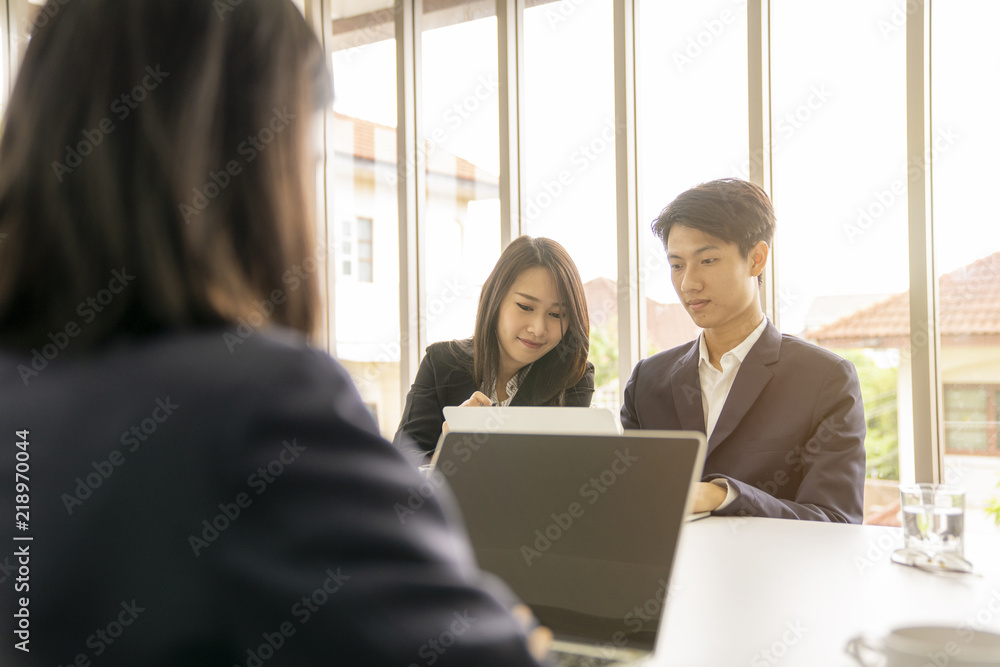 Young business man presented or discuss to client about business project in coference or meeting room. Young business man presented or discuss to client about business project in coference or meeting room.