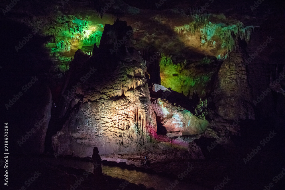 high influx in the karst cave with green illumination