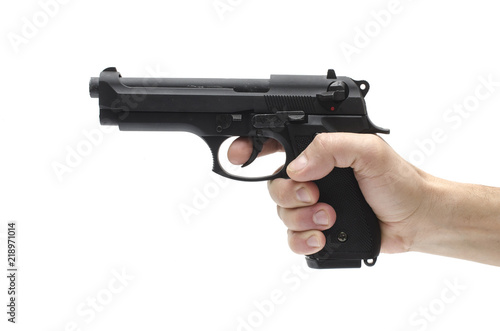 Gun, pistol in hand isolated on white