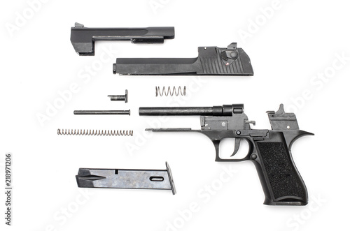 disassembled gun on a white background
