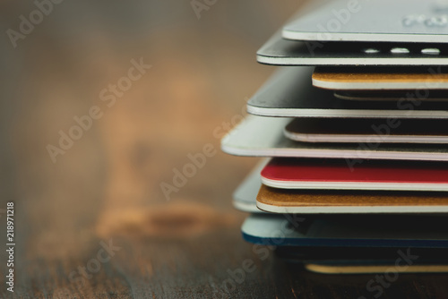 Stack of multicolored credit cards close-up 