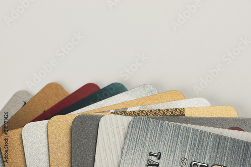 Stack of multicolored credit cards close-up 