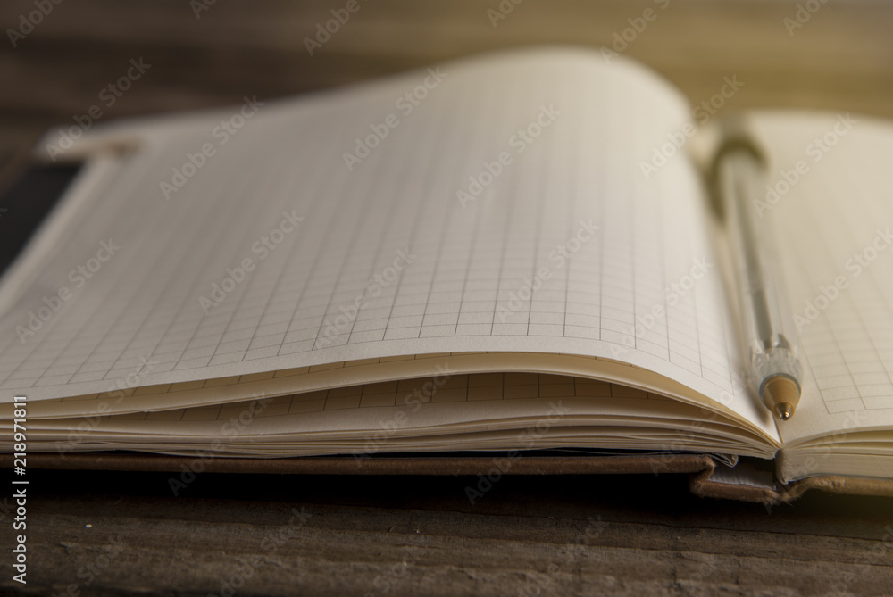 Work and time management, opened notebook over rustic, old textured wooden table. Copy space. Back to school. Work and time management, opened notebook over rustic, old textured wooden table. Copy space. Back to school.