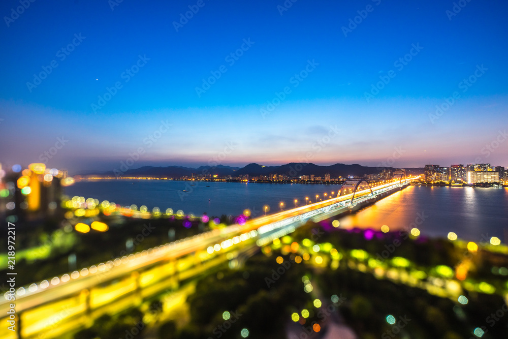 Fototapeta premium busy traffic road with city skyline