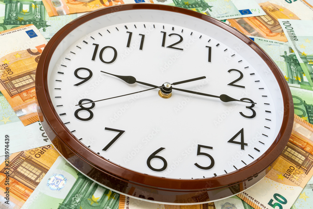 Clock and Euro currency banknotes Clock and Euro currency banknotes
