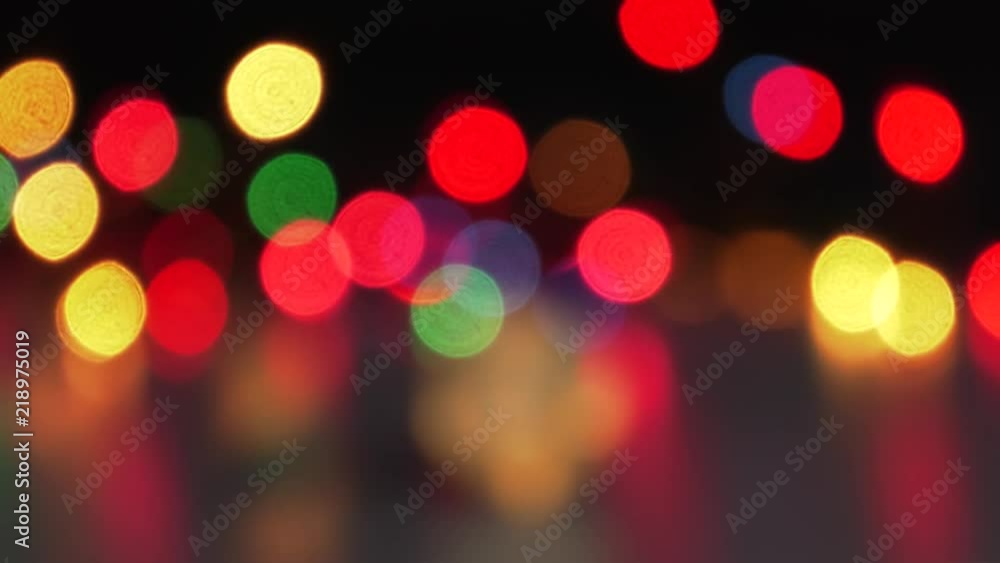 Golden Bitcoin currency. Festive atmosphere. Colorful Christmas tree lights in the background. BTC is a cryptocurrency and is the first decentralized peer-to-peer payment network.4K, Panning, Closeup. Golden Bitcoin currency. Festive atmosphere. Colorful Christmas tree lights in the background. BTC is a cryptocurrency and is the first decentralized peer-to-peer payment network.4K, Panning, Closeup.