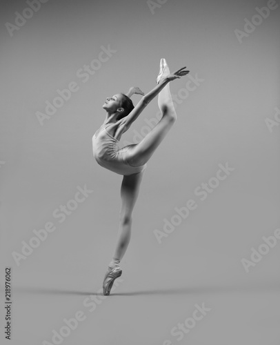 A ballerina is dancing in the studio