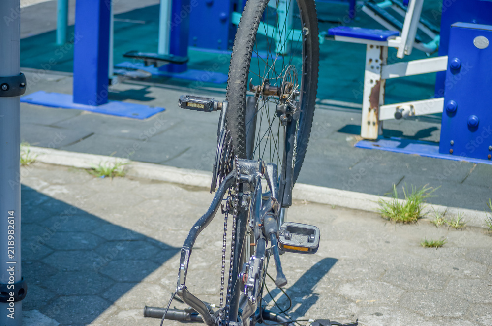 Inverted bicycle with a wheel on in the open air Inverted bicycle with a wheel on in the open air