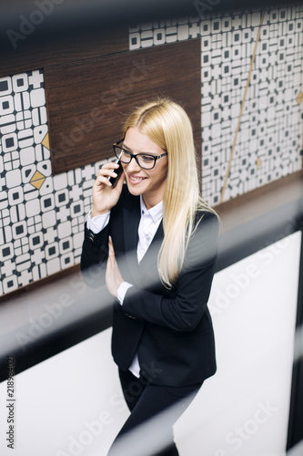 Young businesswoman using m...