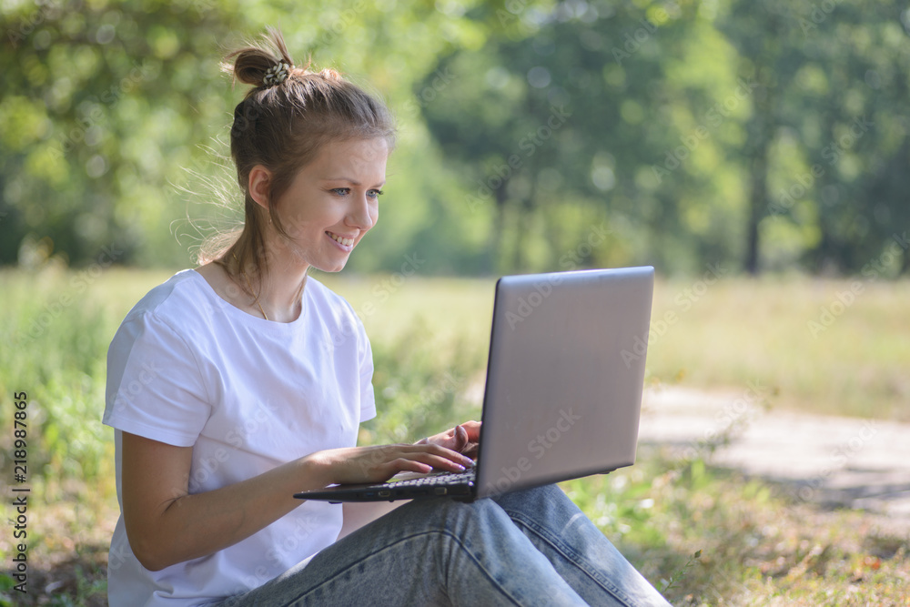 Lovely girl with laptop outdoors Lovely girl with laptop outdoors