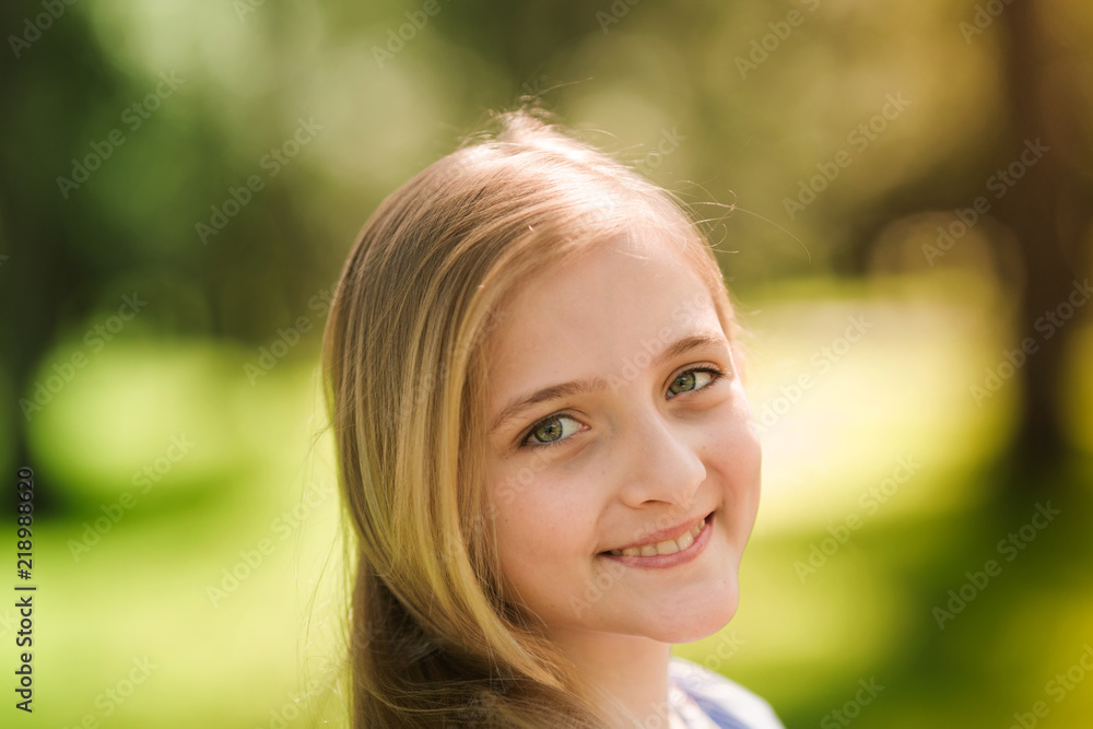 Portrait of a beautiful young girl in the park Portrait of a beautiful young girl in the park