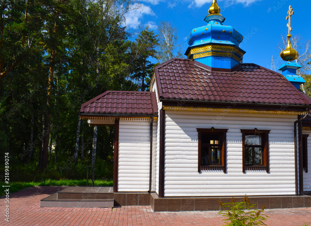 Orthodox monastery in the city of Krasnoyarsk. Orthodox church. Church in the woods. Church bell.