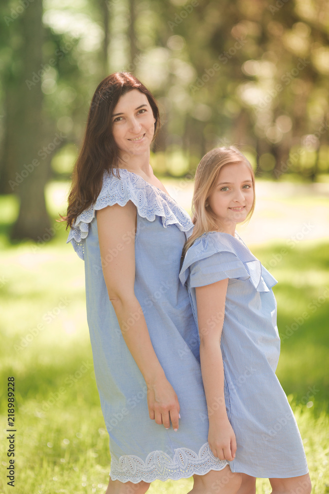 Happy mother and daughter in the park Happy mother and daughter in the park