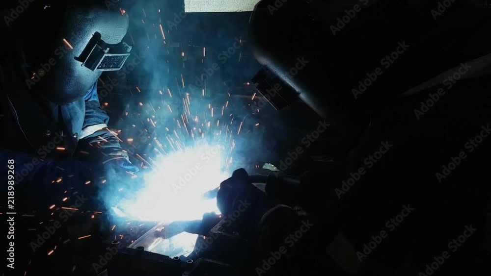 welder, welding automotive part in a car factory welder, welding automotive part in a car factory
