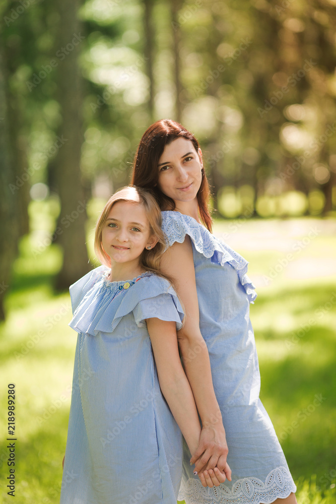Happy mother and daughter in the park Happy mother and daughter in the park