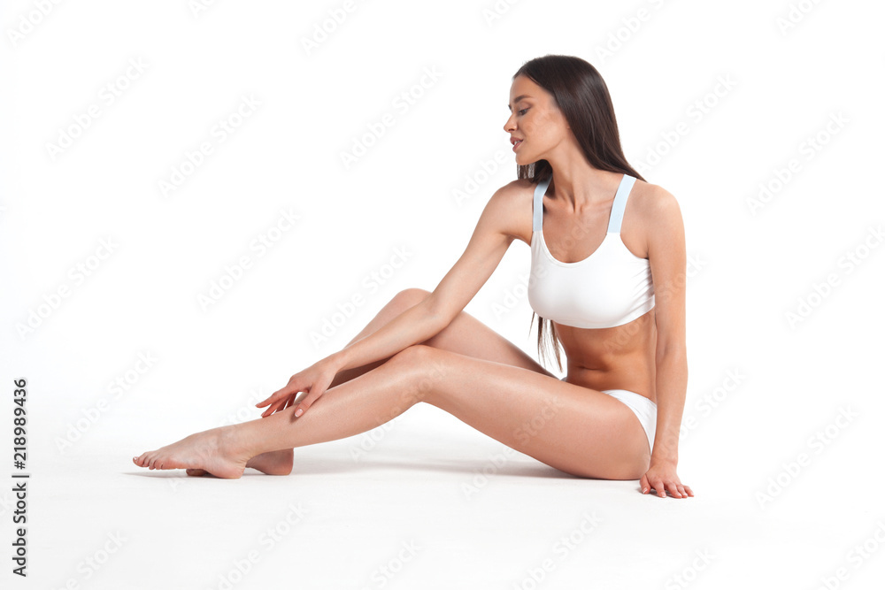 Slim young woman in underwear on white background Slim young woman in underwear on white background