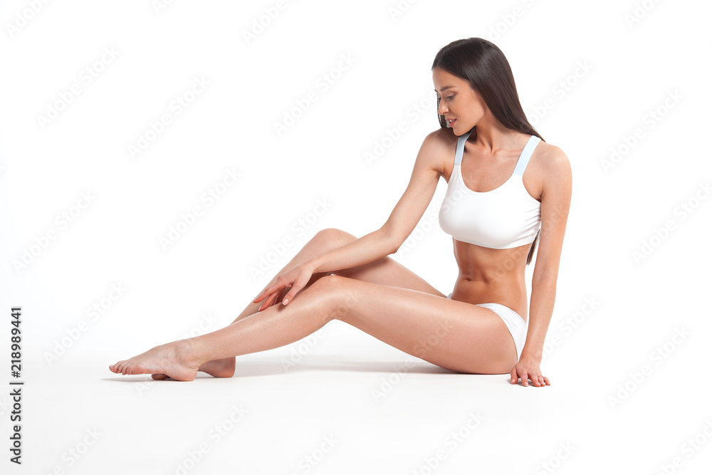 Slim young woman in underwear on white background Slim young woman in underwear on white background