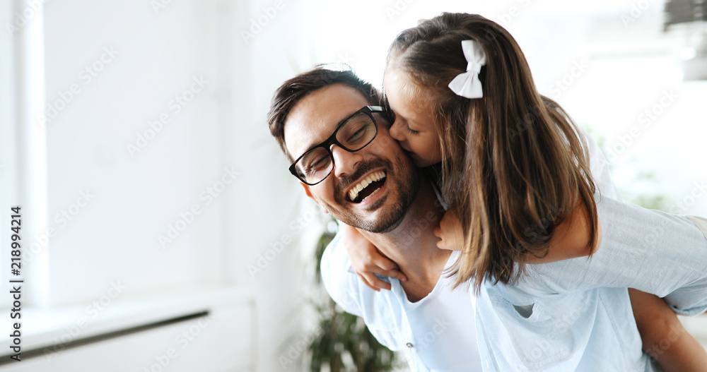 Portrait of father and daughter playing at home - obrazy, fototapety, plakaty 