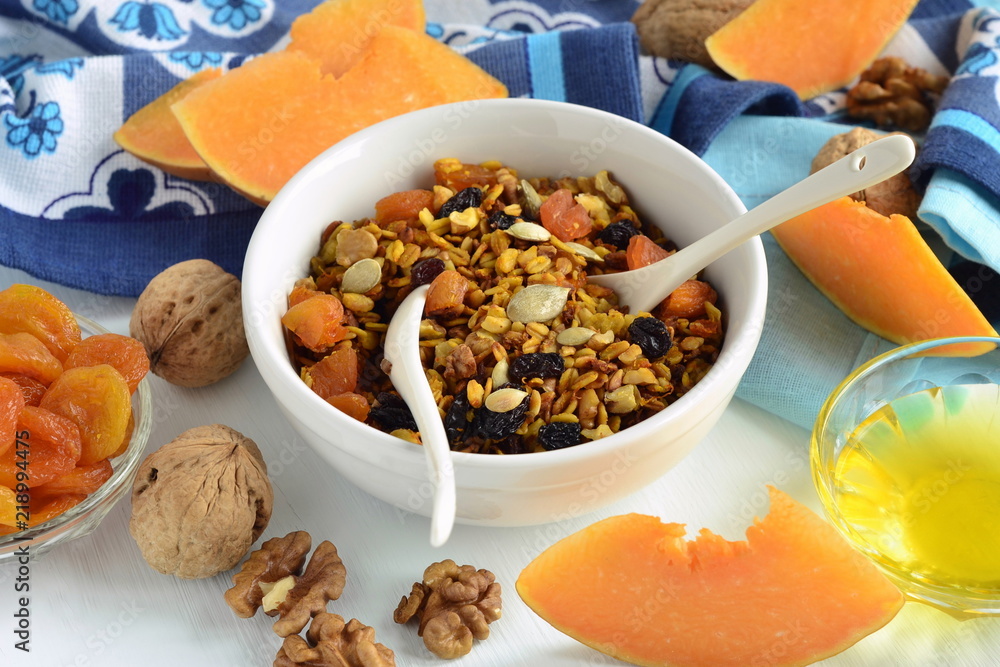 Fototapeta premium Pumpkin homemade granola with walnuts and dried fruits