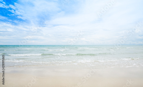 Beach and sea with white cloud and blue sky background