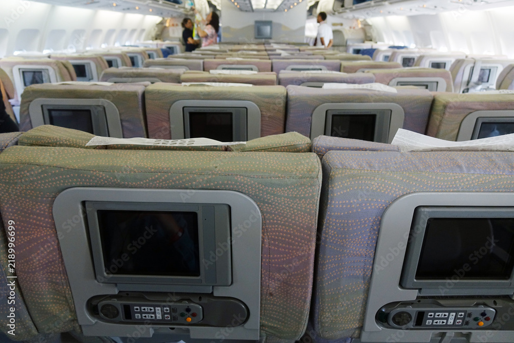 The interior of an empty aircraft, ready to fly cabin airliner with rows of seats. The interior of an empty aircraft, ready to fly cabin airliner with rows of seats.