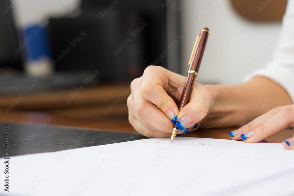 Business woman signing important documents Business woman signing important documents