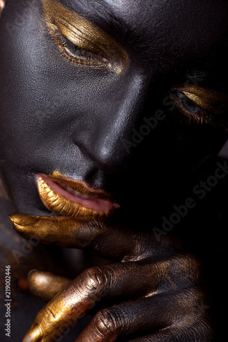 Portrait of a beautiful girl with creative, fantasy make-up.