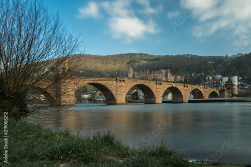 The old bridge of Heidelberg reflecting perfectly in the Neckar, Germany, Europe during Fall