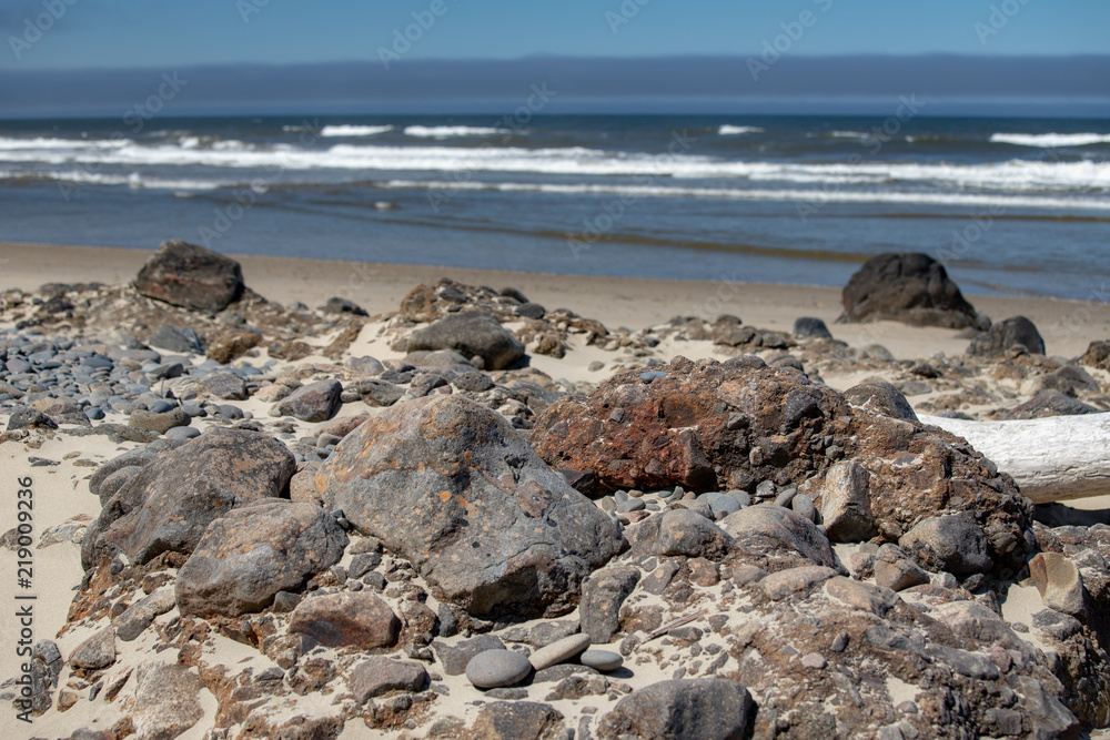 an assortment of rocks on the beach at Cape Perpetua Scenic Area in Central Oregon Pacific Northwest USA near Yachats