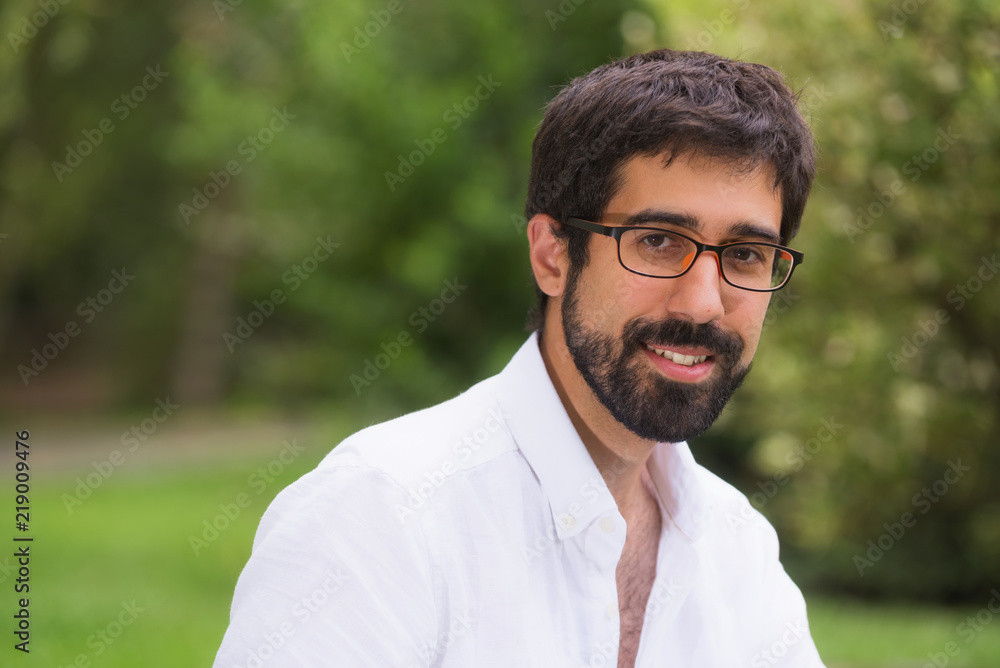 Portrait of a handsome young man in the park Portrait of a handsome young man in the park