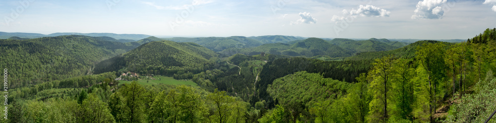Panorma of middle range mountain in Vosges north east France. Alsace region of north east France. Landscape full of mountains, flowers, trees ,sun, villages and forests.