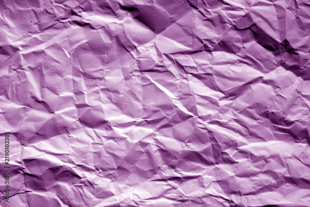 Crumpled sheet of paper in purple tone.