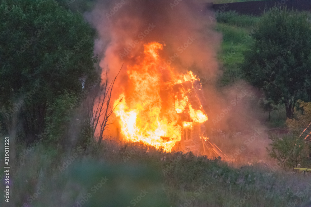 a wooden private house in gardening on fire a wooden private house in gardening on fire