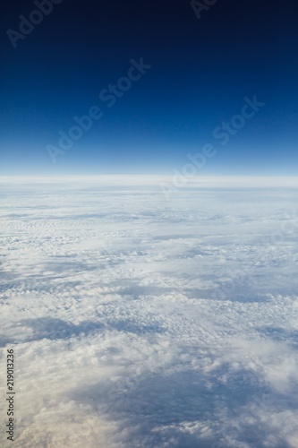 high sky above the clouds, blue atmosphere background