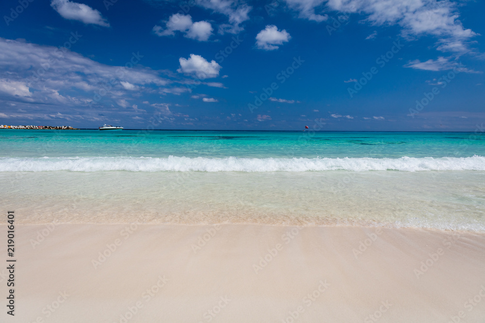 Pristine white sandy beach and turquoise coloured sea in Cancun