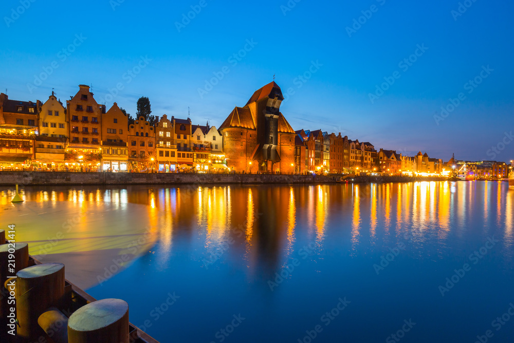 Old town of Gdansk reflected in Motlawa river at dusk, Poland