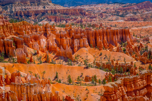 Bryce Canyon National Park landscape, Utah, United States. Nature scene showing beautiful hoodoos, pinnacles and spires rock formations. including Thors Hammer, in a gorgeous blue sky photo
