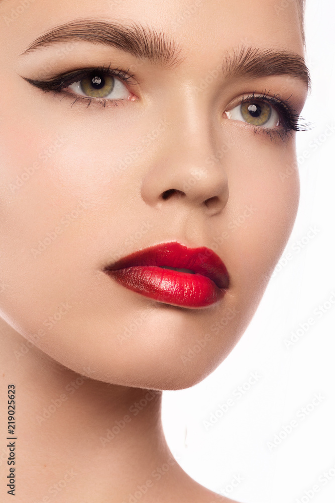 Close up portrait of beautiful young model with professional makeup, perfect skin. Trendy eyelines and red lips. Shiny eyelines Close up portrait of beautiful young model with professional makeup, perfect skin. Trendy eyelines and red lips. Shiny eyelines