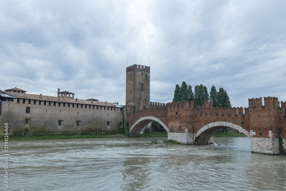 Castelvecchio bridge with castle wall and tower.