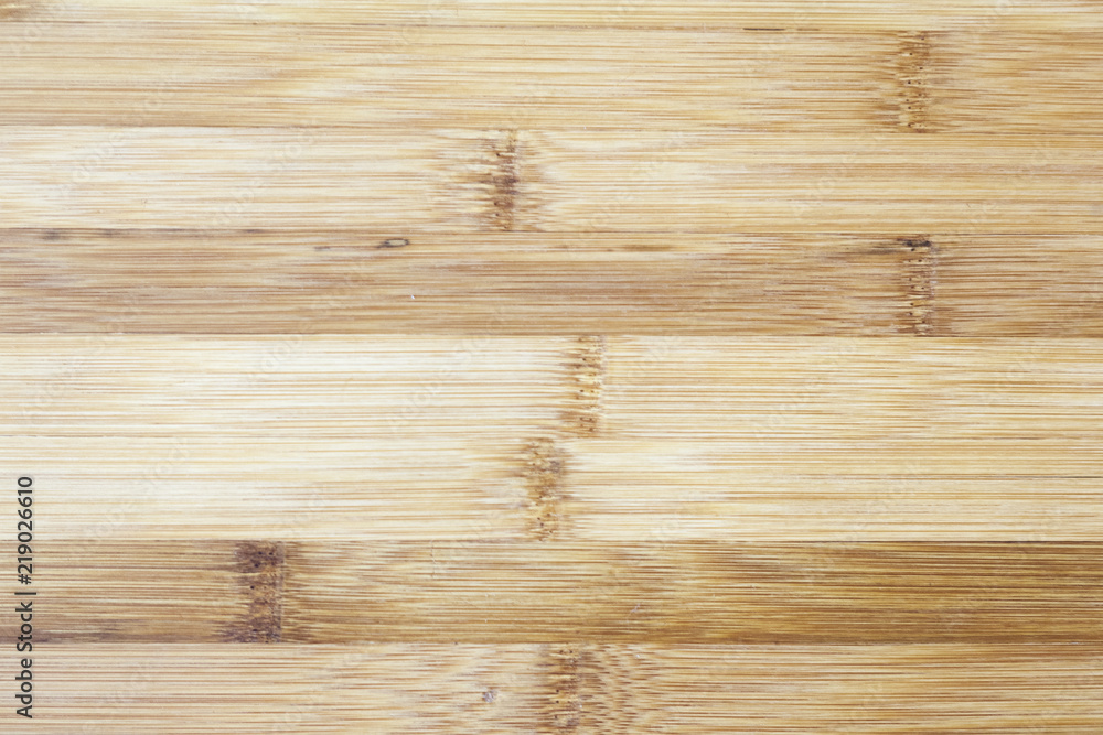 Board made of natural bamboo wood. Textures pattern background in light yellow cream beige brown color. Board made of natural bamboo wood. Textures pattern background in light yellow cream beige brown color.