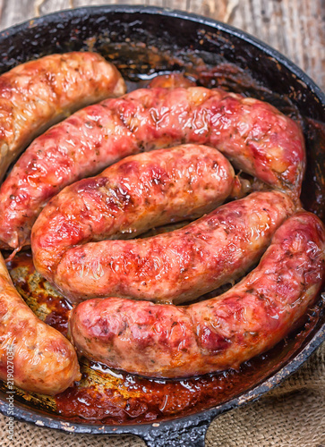 Fried sausages on a fry pan 