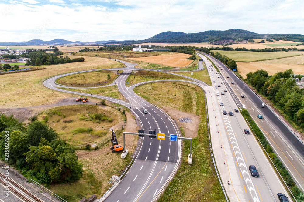 Aerial view of a highway intersection with a clover-leaf interchange Germany Koblenz