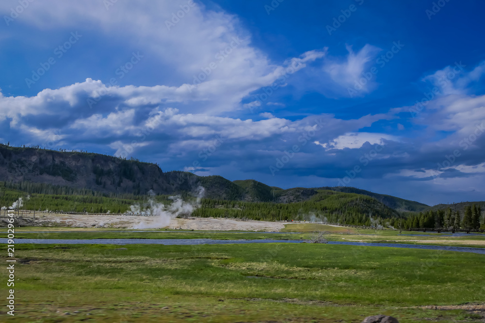 Amazing landscape of river crossing close to small geysers, hot springs, and vents. in Norris Geyser Basin, Yellowstone National Park