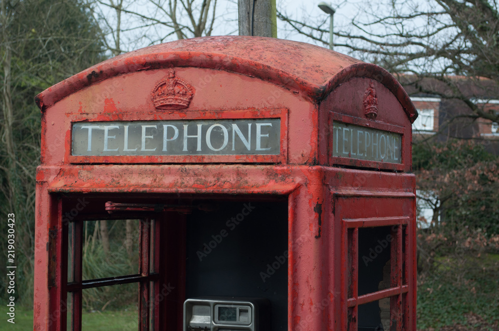 Disused retro red phone box telephone sign Disused retro red phone box telephone sign
